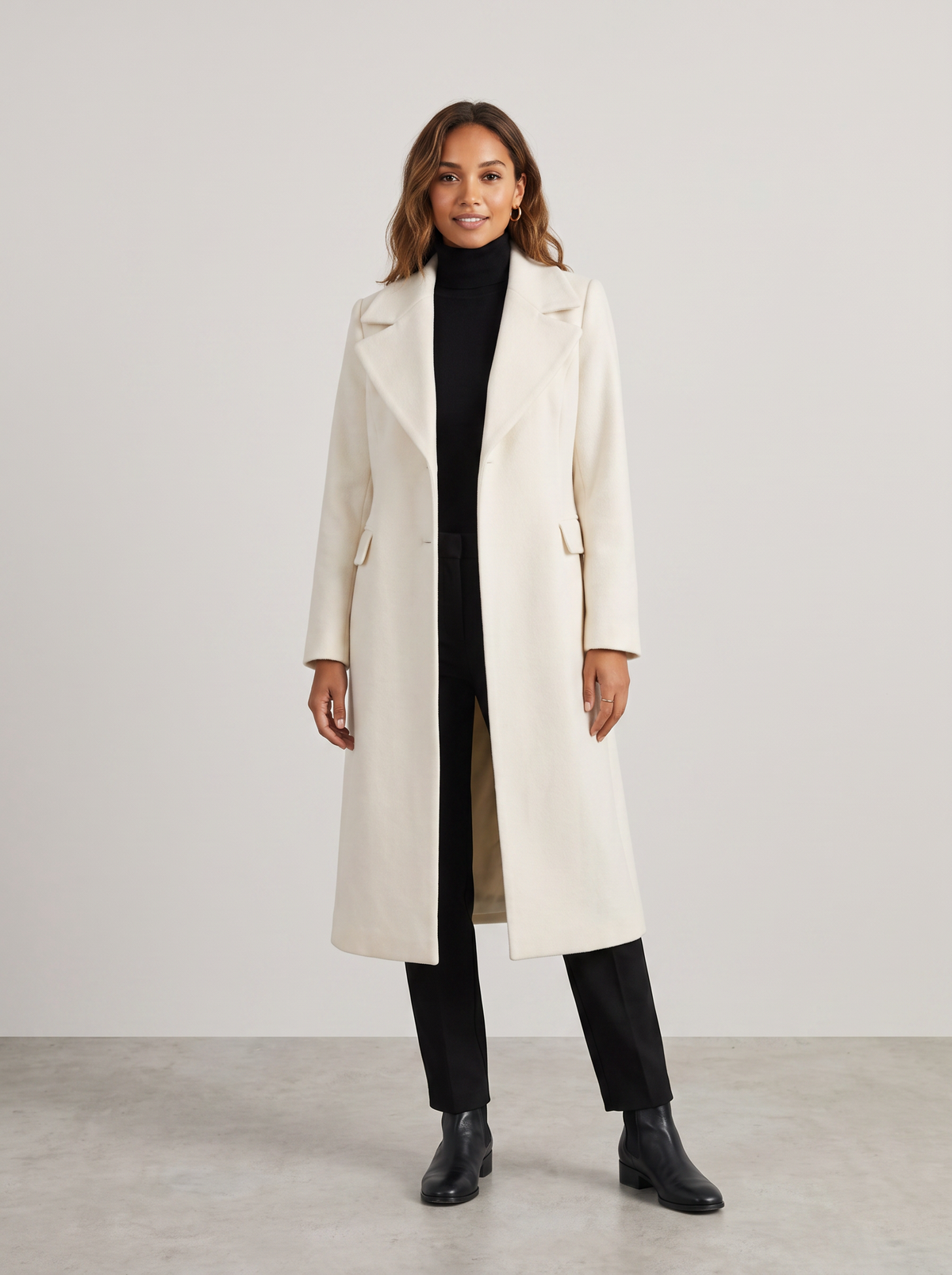 Antonia | Women's Elegant Long Coat in cream, worn by a model, full-length studio photo