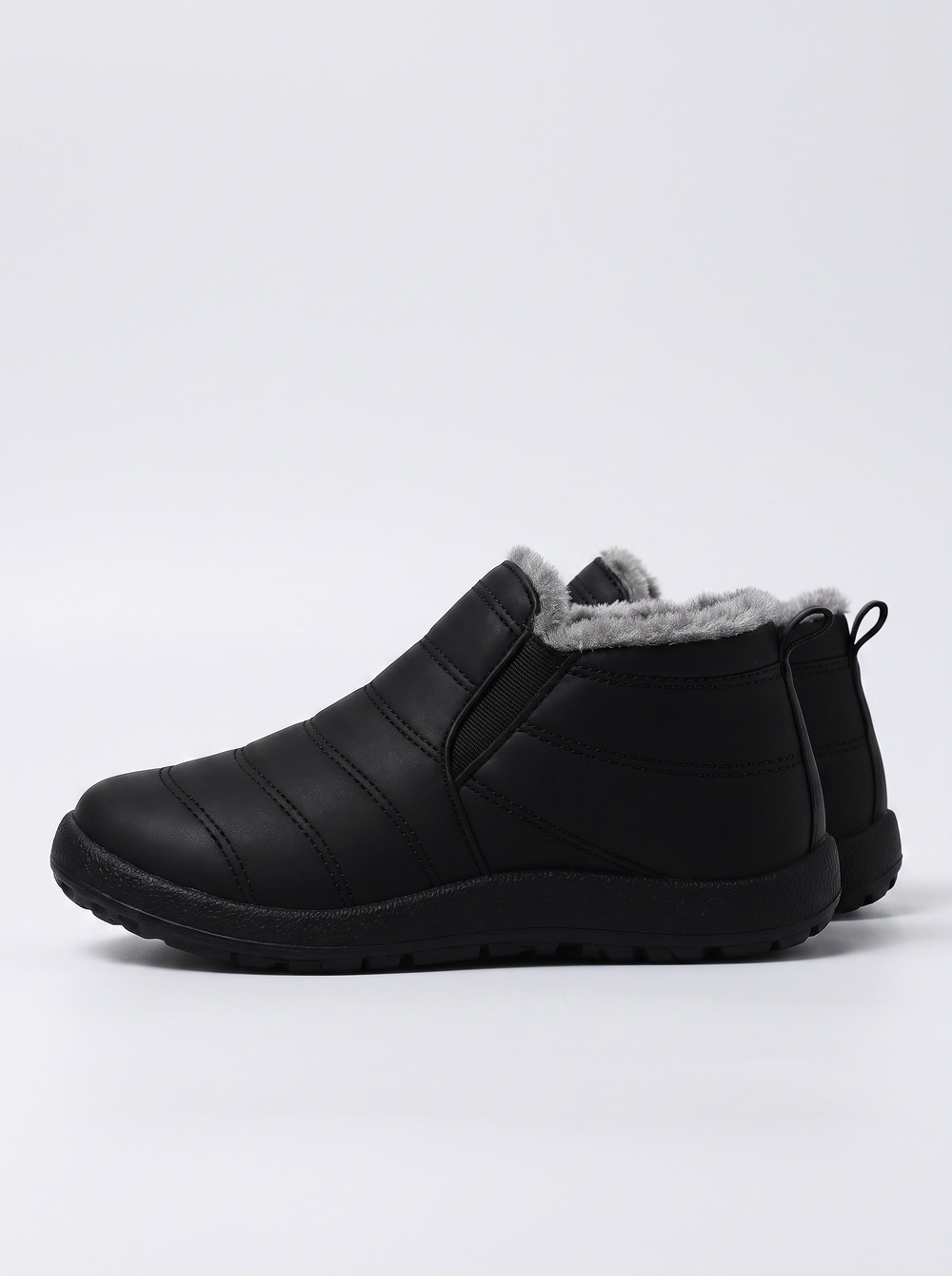 Holly Women's Cozy Slip-On in black, side profile view