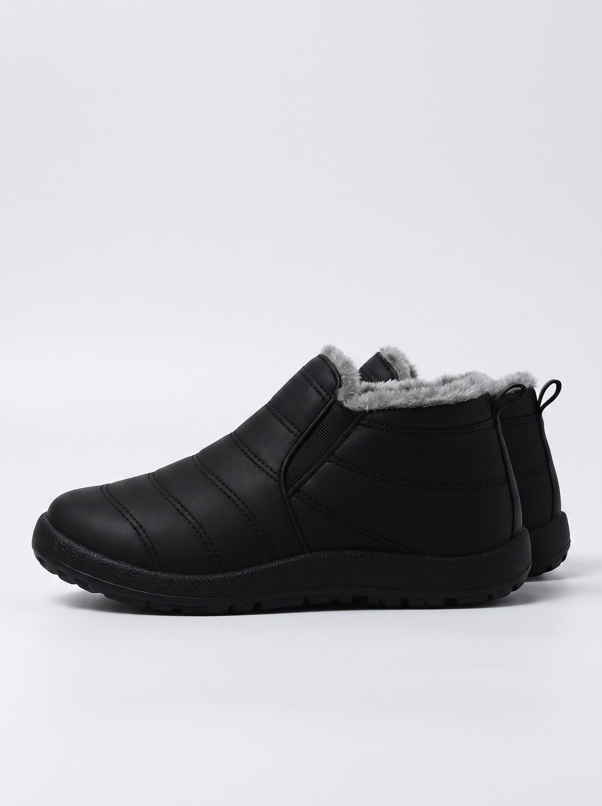 Holly Women's Cozy Slip-On in black, side profile view