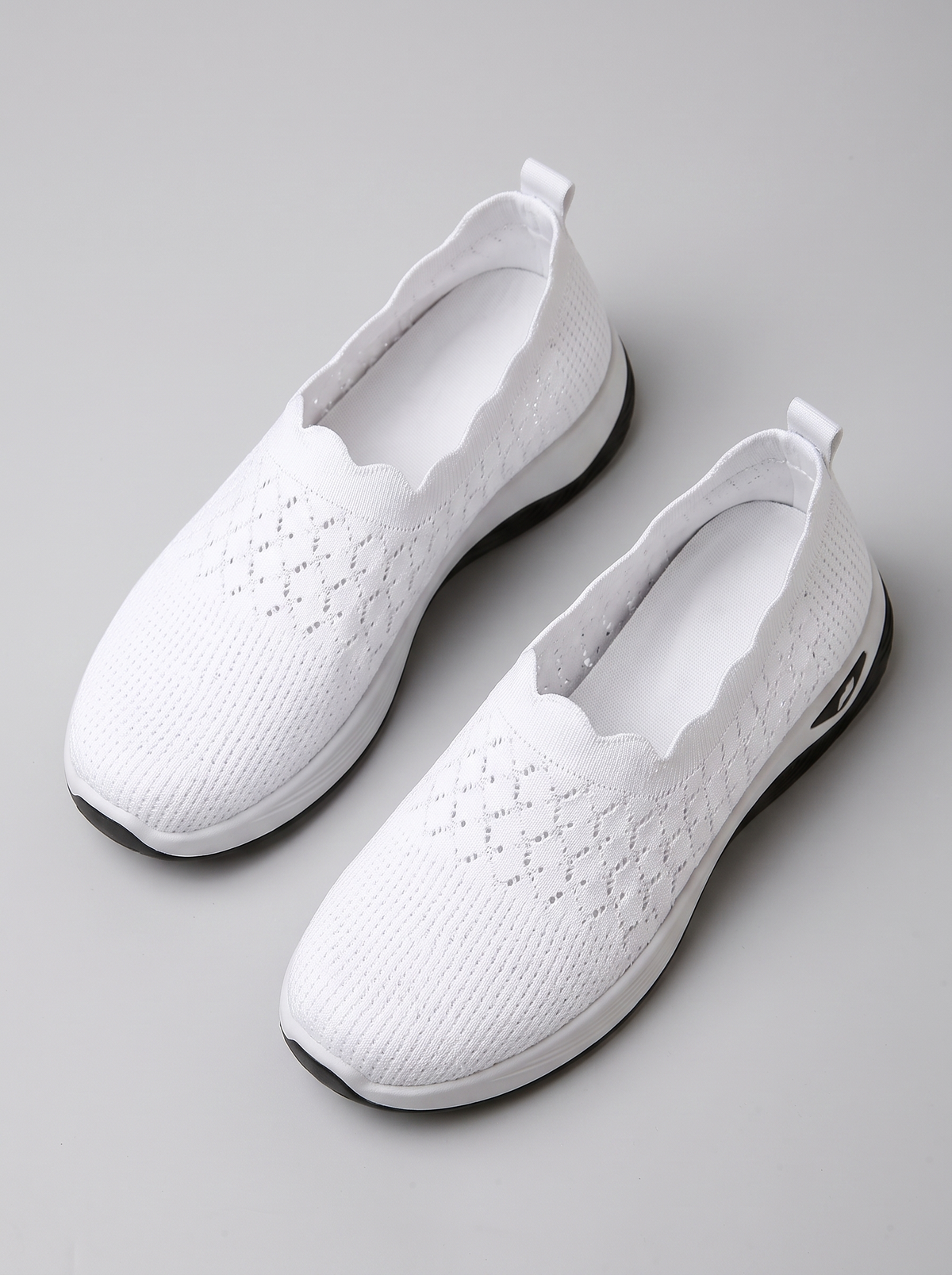 Remi Women's Ultra-Light Slip-On in white, pair seen from above