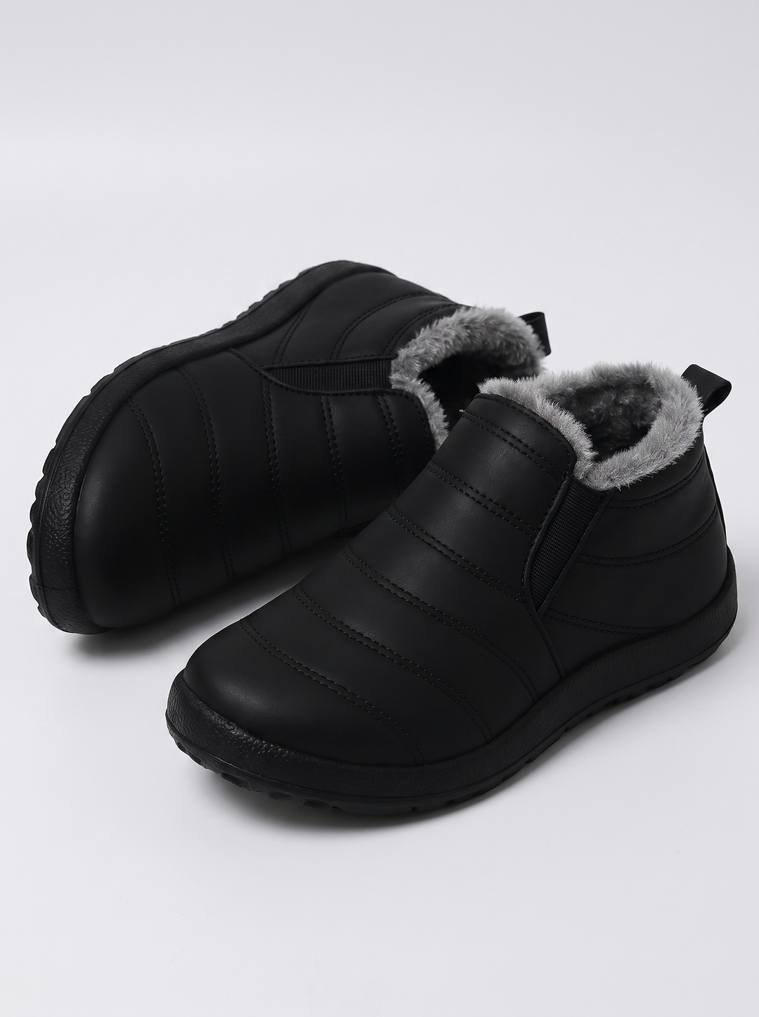 Holly Women's Cozy Slip-On in black, three-quarter front view