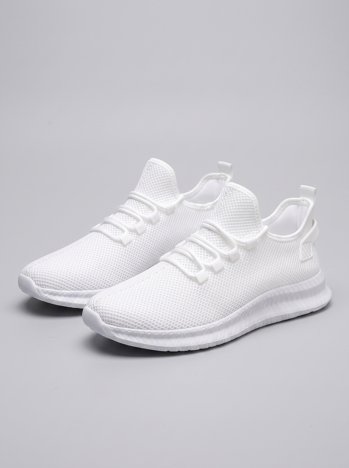 Run witte hardloopschoenen paar driekwart